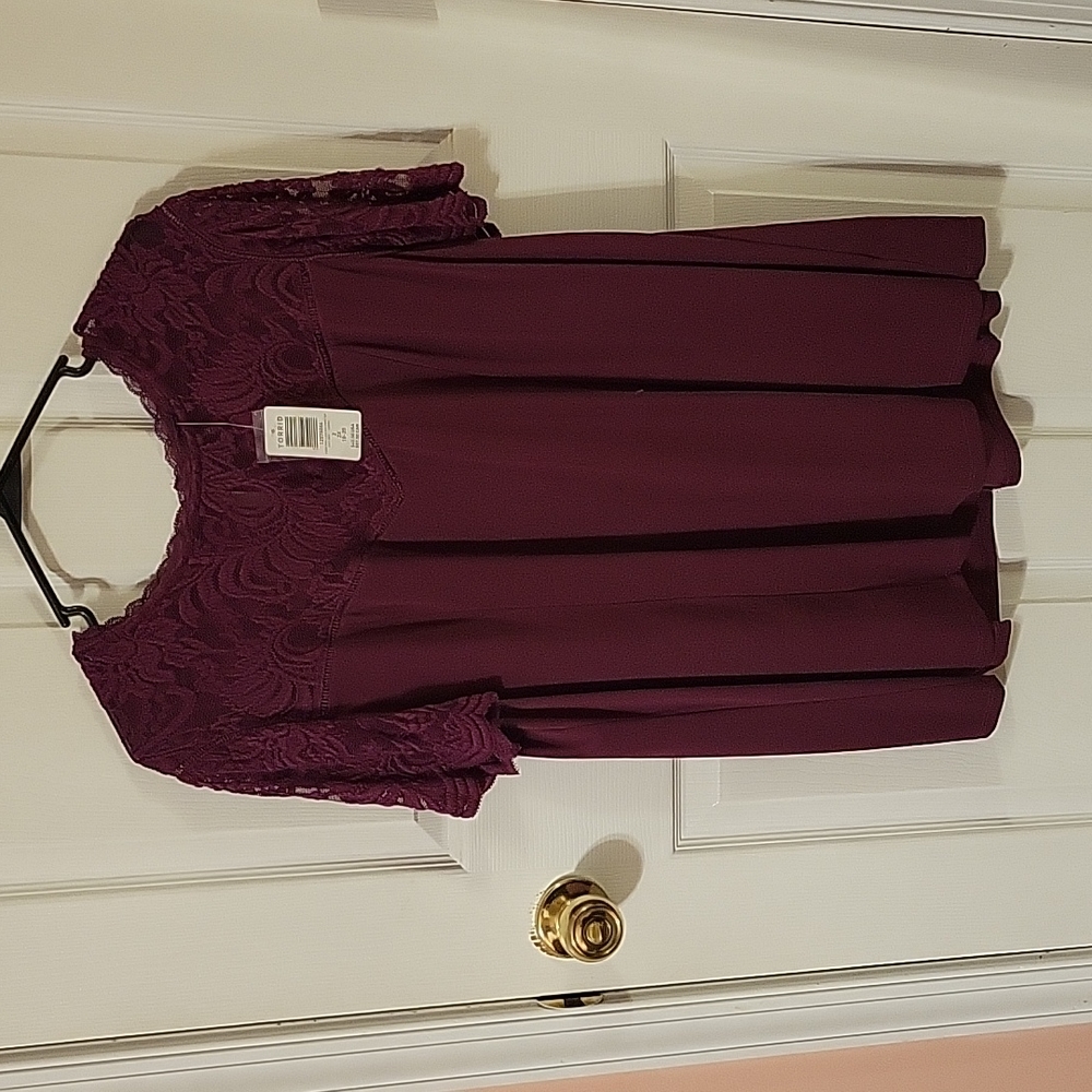Torrid NEW size 2 purple short sleeved blouse. Lace sleeves with scalloped edge.